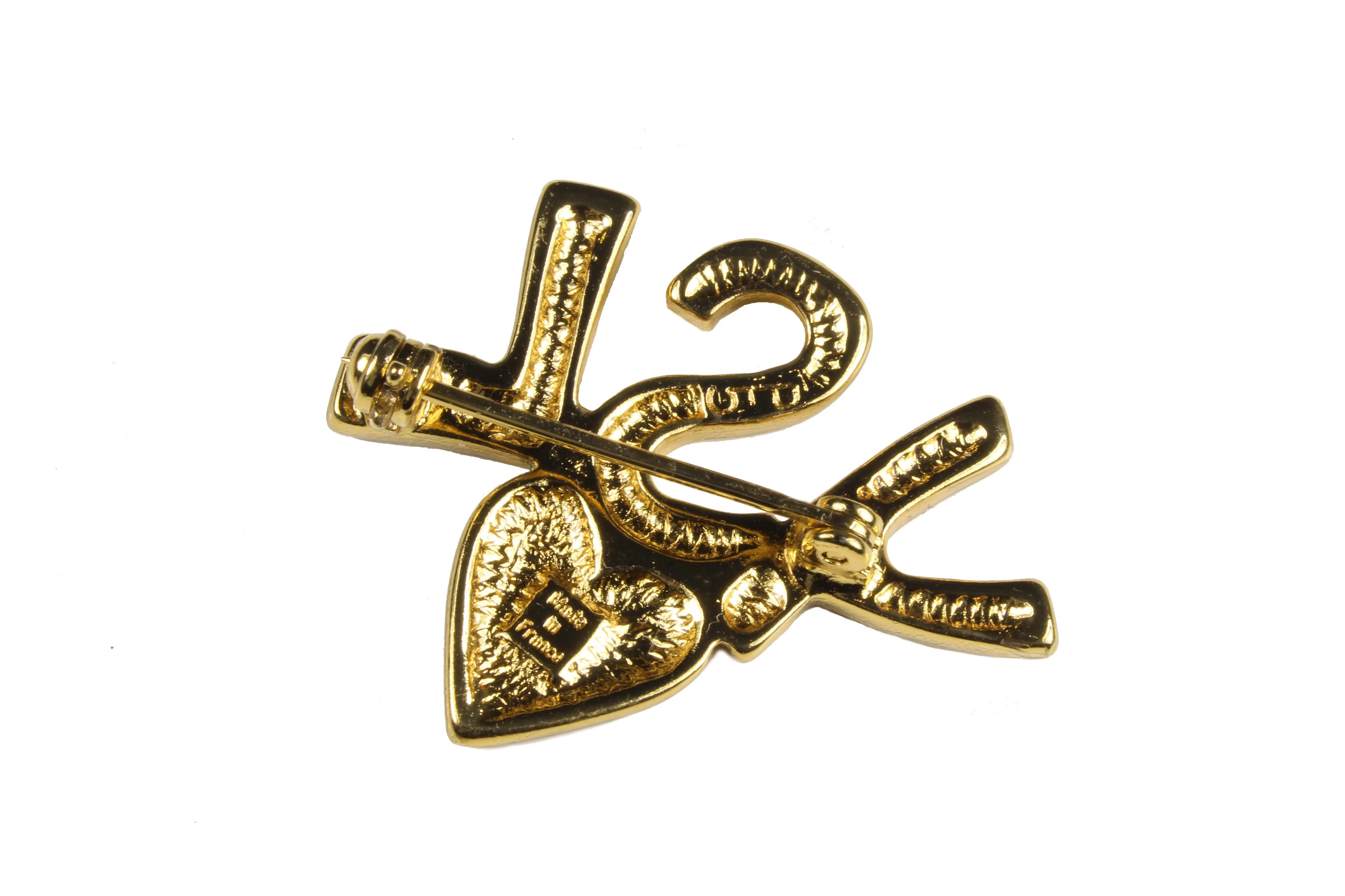 YVES SAINT LAURENT initials over heart brooch